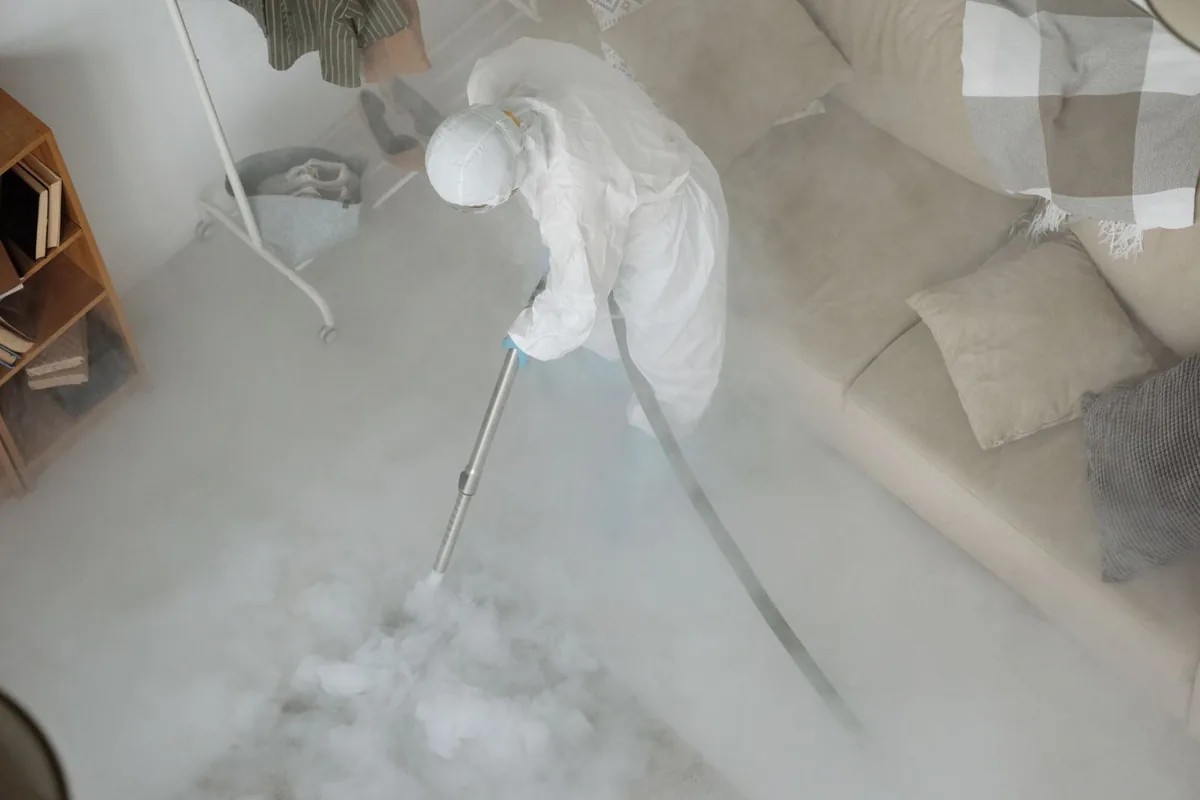 Biohazard cleanup technician in protective equipment, John Day, OR